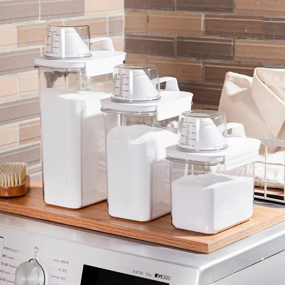 ClearTidy detergent dispenser with airtight lid and measuring cup for laundry powder.